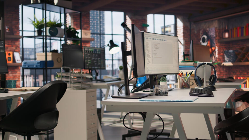 Modern computer desk in a contemporary Edmonton office workspace with sleek furniture and technology setup
